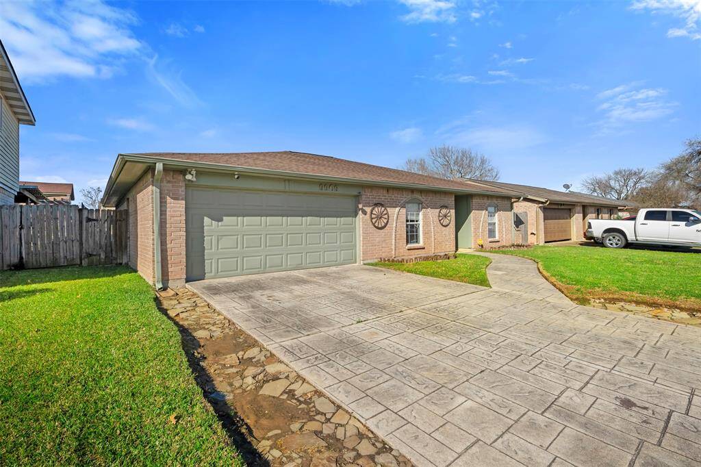 Long driveway and double car garage