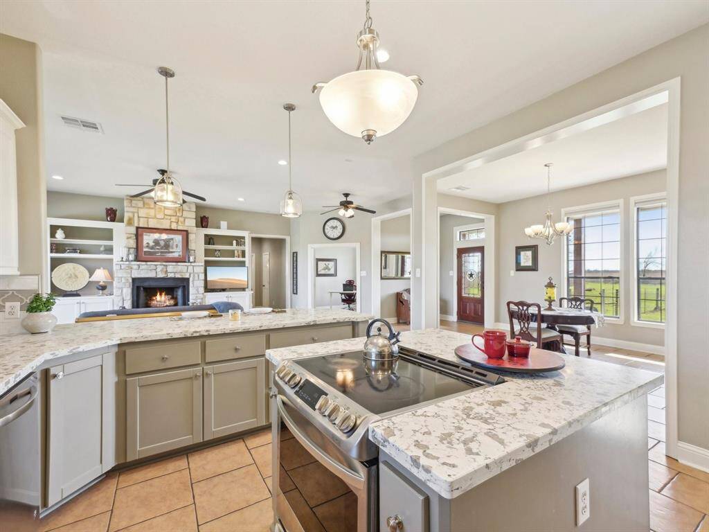 Check out this beautifully updated Kitchen! Gorgeous quartz counters are the crowning jewel on the cabinetry.