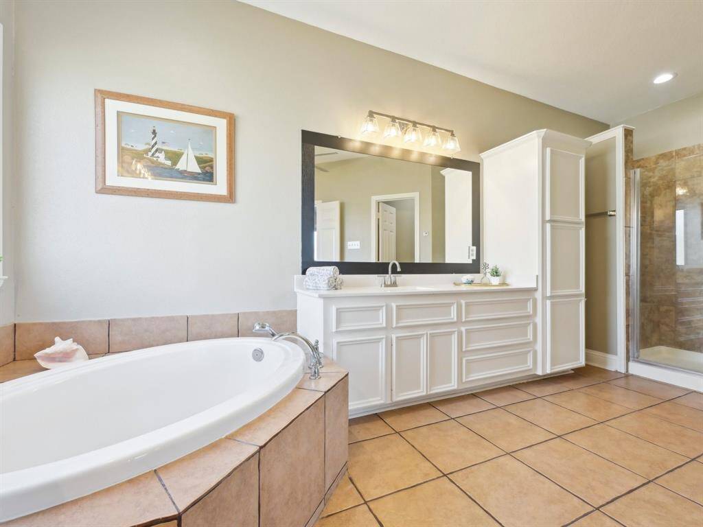 The separate shower is located to the right.