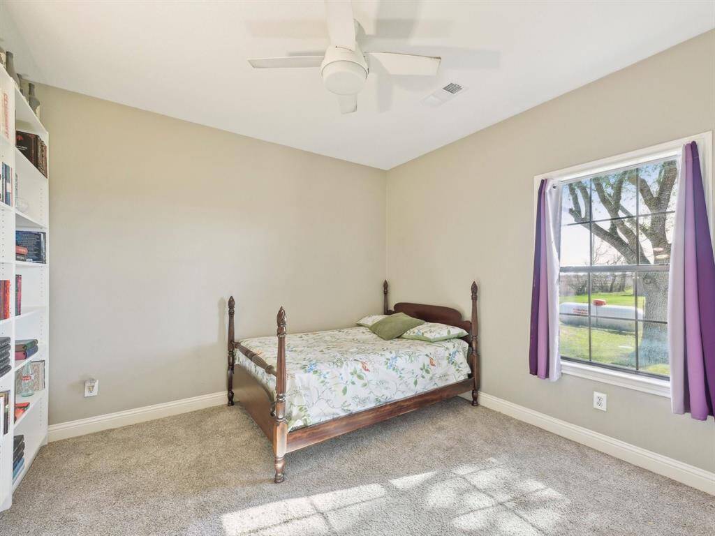 Bedroom 2 is spacious and features a walk-in closet.