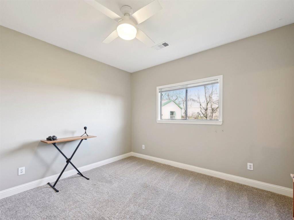 Bedroom 3 has ample room and a walk-in closet.