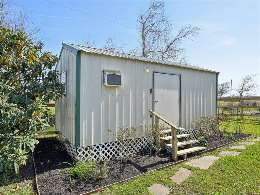 The she shed has a shower and sink inside. It's a great place for all your crafting needs.