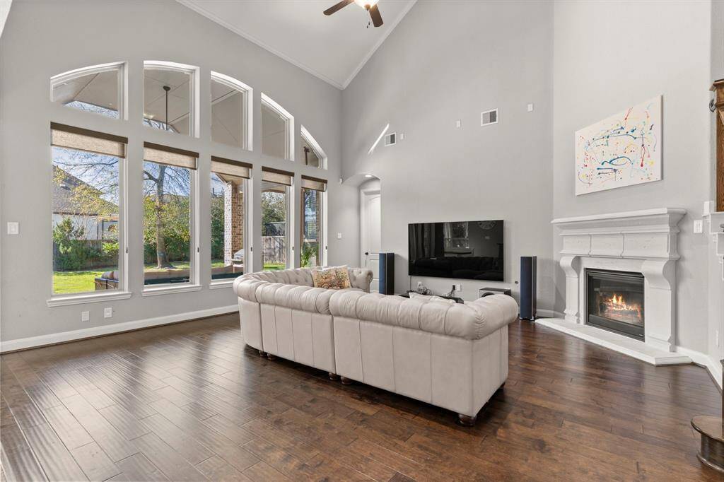 Vaulted celiing and large windows off the back of the home.