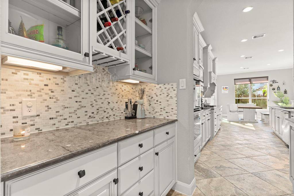 Beautiful dry bar pass through between the formal dining and kitchen.