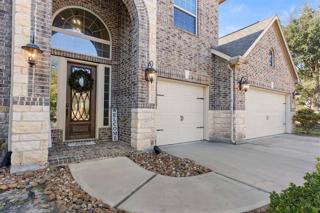 3 car attached garage and a grande entrance.