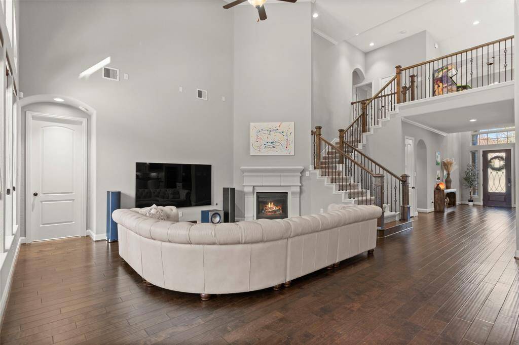 View of the large open living space, perfect for entertaining! View of the primary bedroom access door.