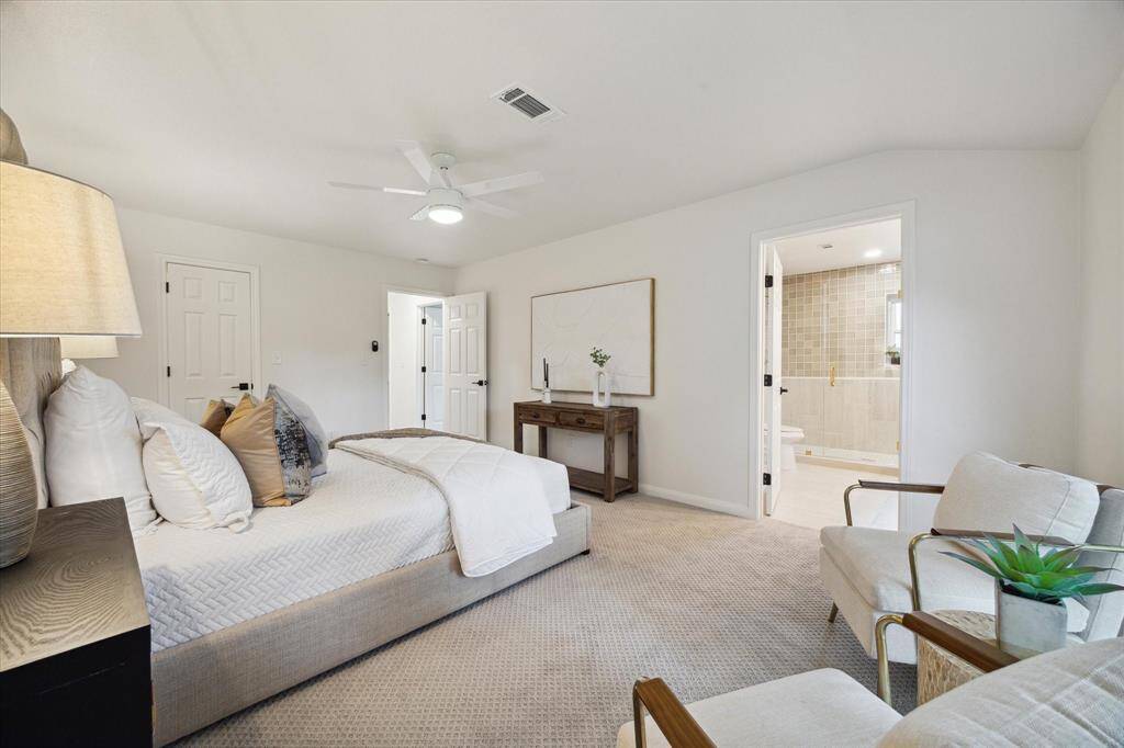 DOUBLE DOORS OPEN UP TO THE LUXURIOUS UPGRADED ENSUITE BATHROOM.