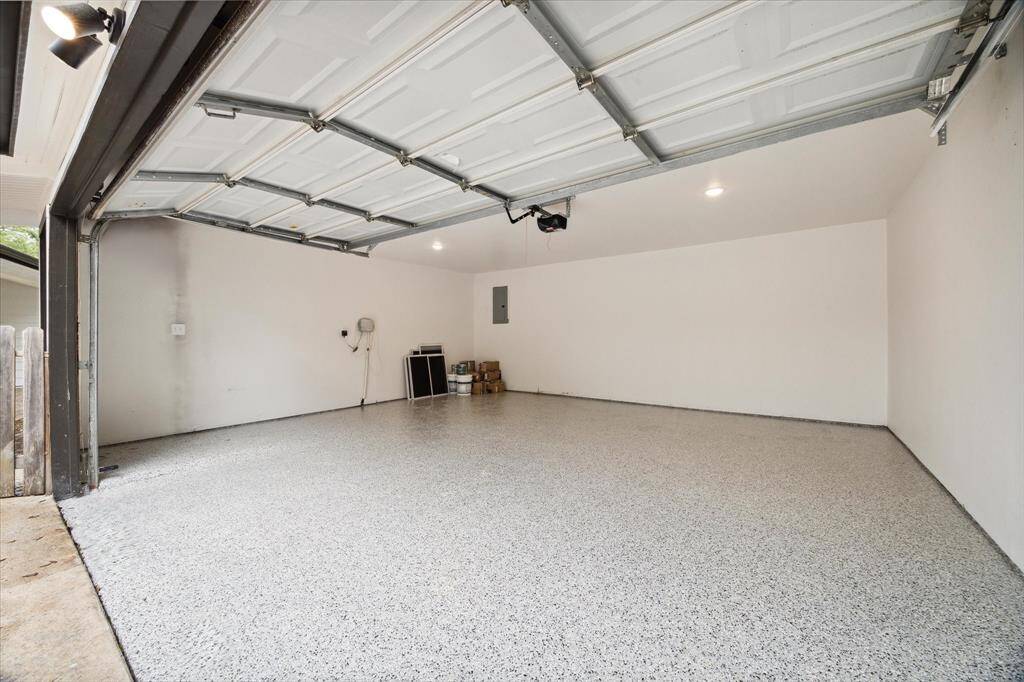 THE GARAGE IS COMPLETELY FINISHED WITH EPOXY FLOORING.