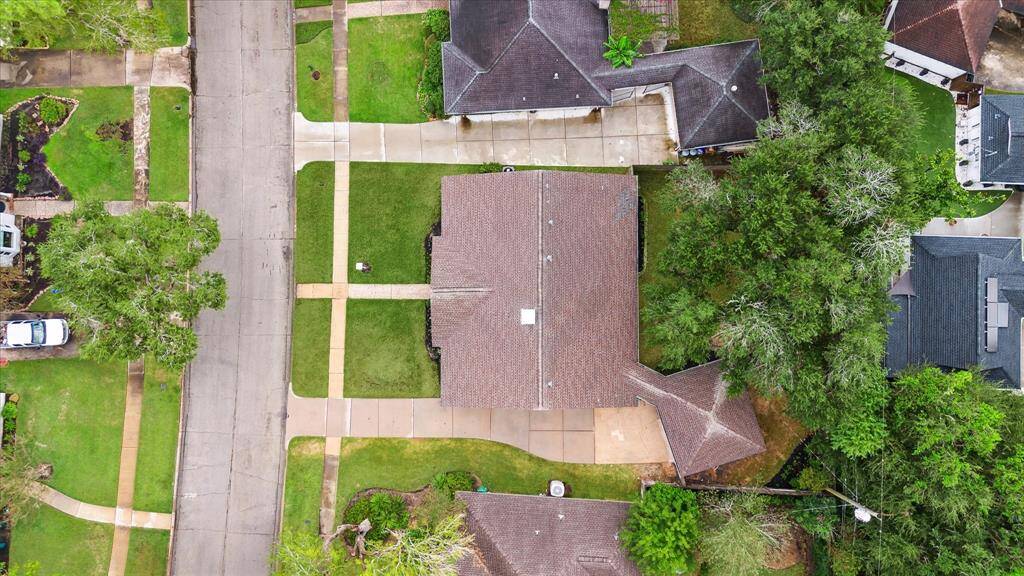 AREIAL VIEWS OF THE LOT WITH MATURE TREES OFFERING PLENTY OF BACKYARD PRIVACY.