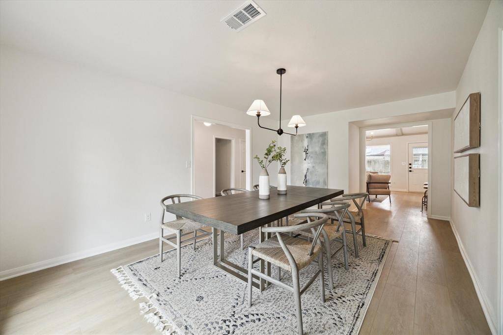 ANOTHER VIEW OF THE DINING ROOM WHICH OPENS UP TO THE KITCHEN/FAMILY ROOM.