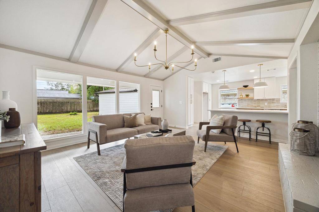 ANOTHER VIEW OF THE FAMILY ROOM WHICH OPENS UP TO THE GOURMET KITCHEN.
