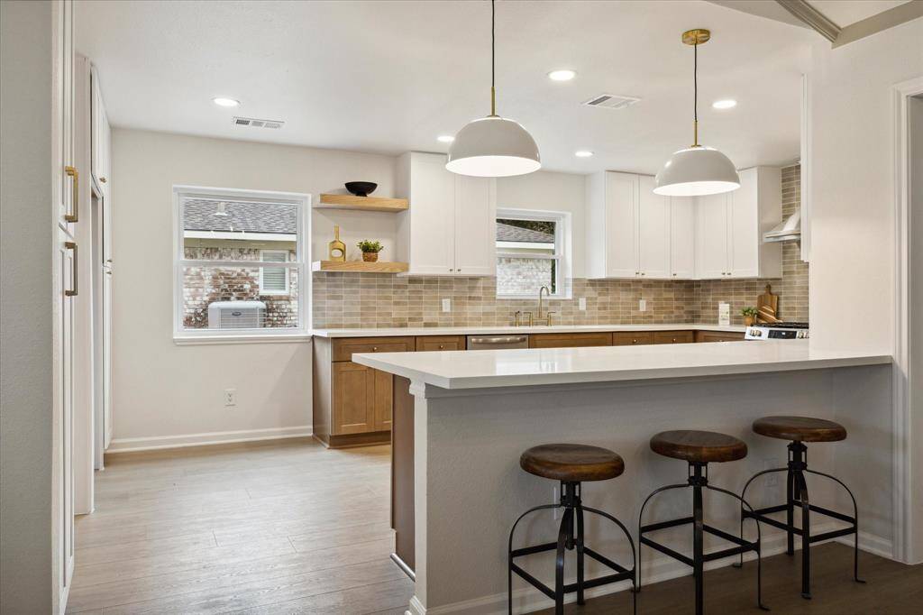THE KITCHEN IS EVERY CHEF'S DREAM WITH BREAKFAST BAR FOR INFORMAL DINING/ENTERTAINING.