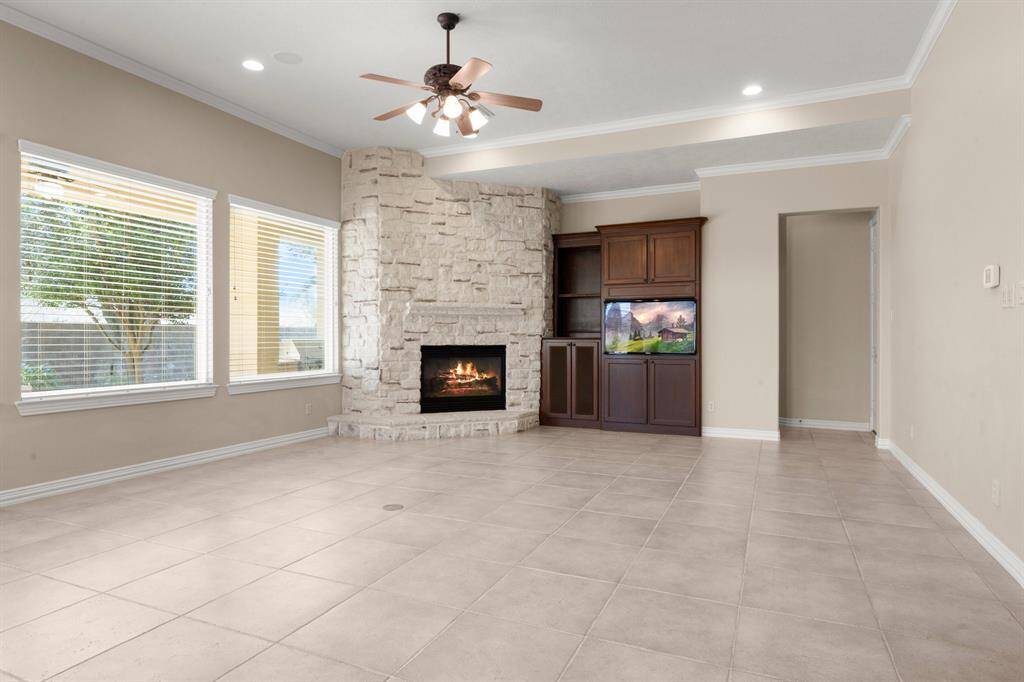 Warm and inviting family room with a cozy gas log fireplace.