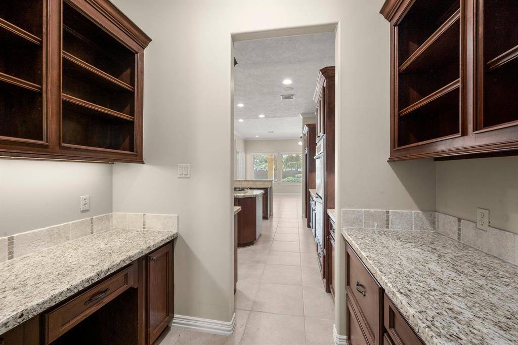 Enhance your culinary experience with a spacious butler's pantry and a convenient built-in desk.