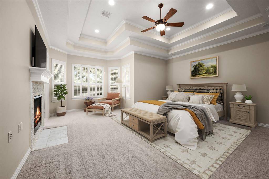 Cozy primary suite featuring an inviting gas fireplace.