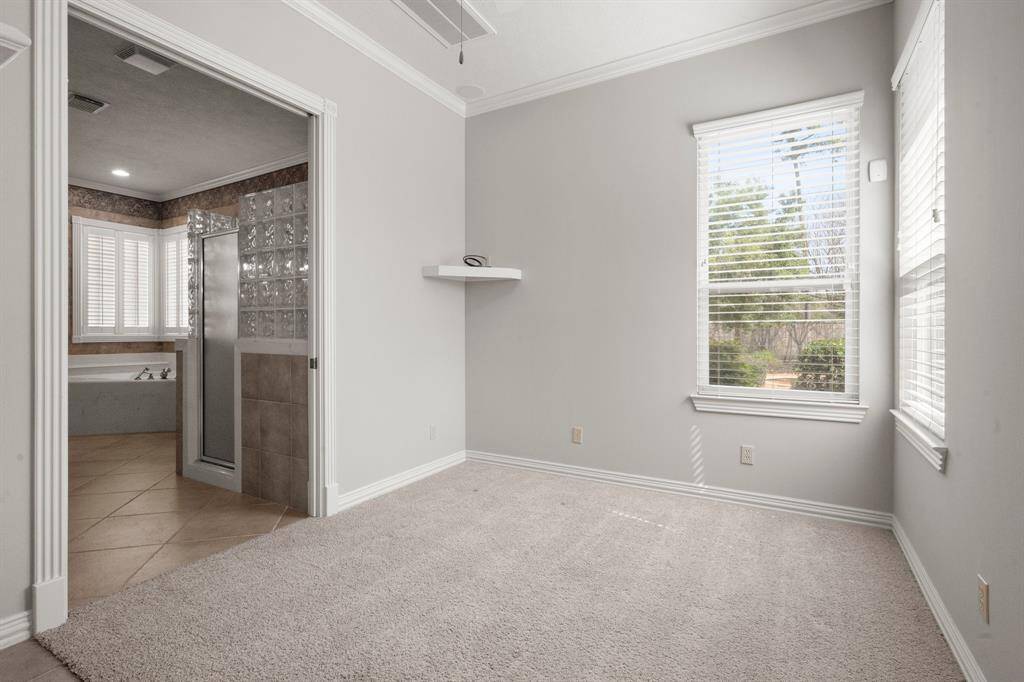 Versatile space off the primary suite, perfect for an exercise room or nursery.