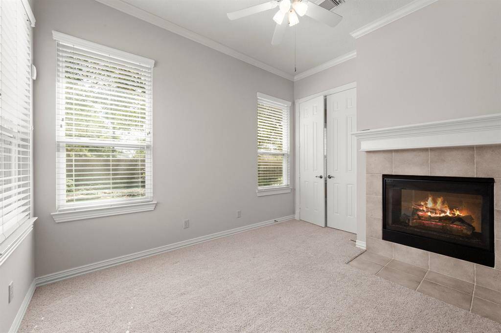 This space also features a luxurious double-sided fireplace shared with the primary suite.