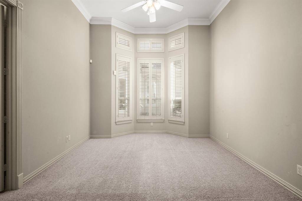 The den area of the casita has large bay windows.
