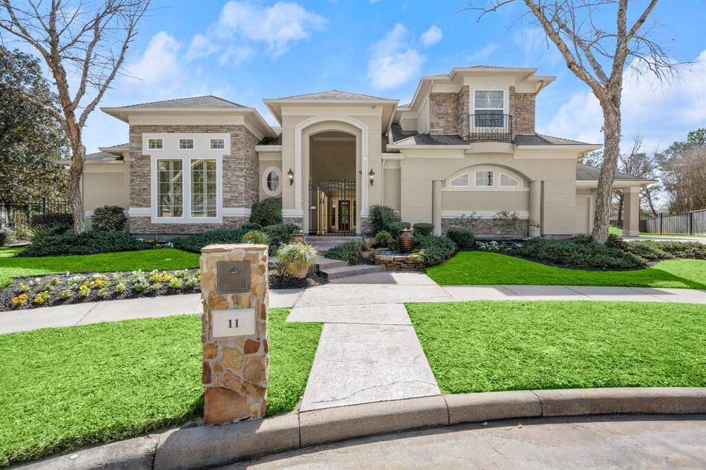 Stunning front view showcasing elegant architecture and lush landscaping, offering a warm welcome to your dream home.