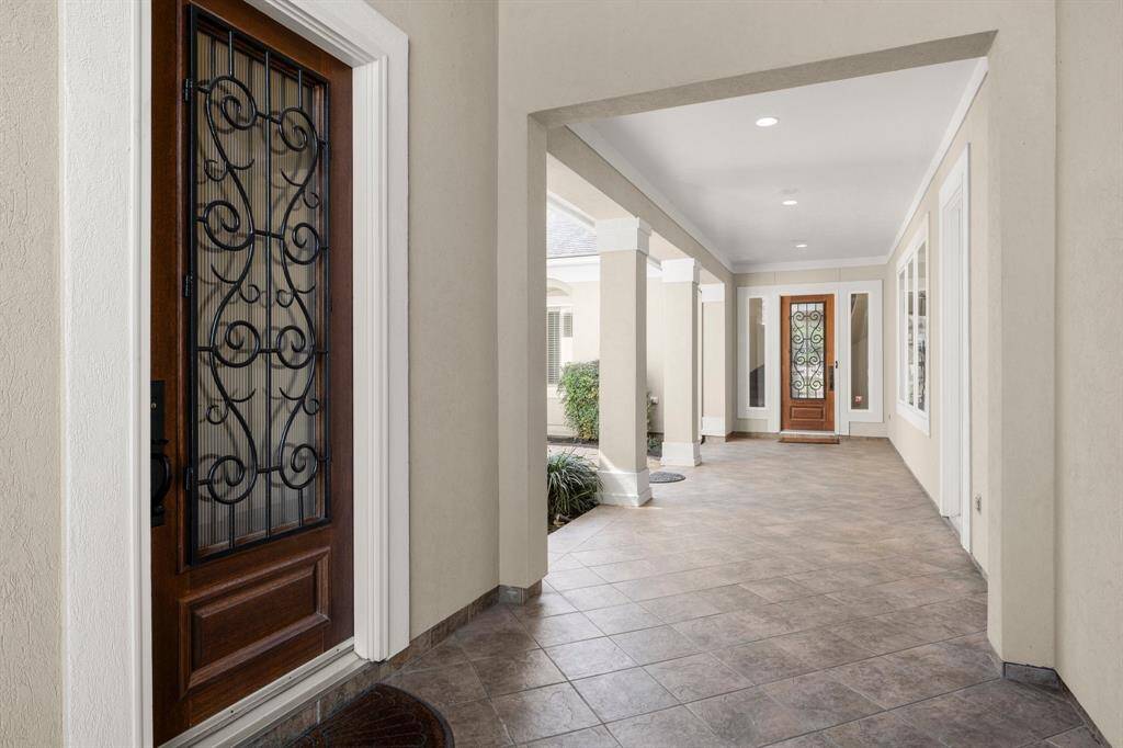 Elegant breezeway seamlessly connects the casita and main house, offering a stylish and functional transition space.