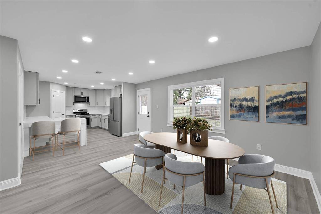 The kitchen is open to the dining room, and includes a breakfast bar with extra countertop space.