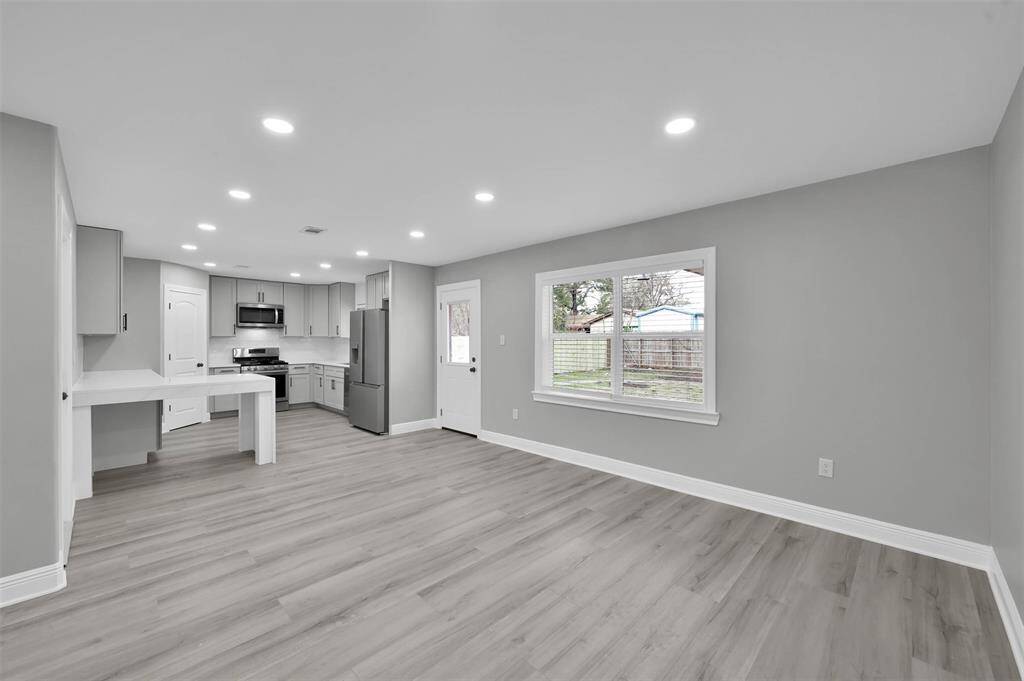 You'll enjoy the view of the large backyard while dining or preparing meals. This makes for a great entertainment space!