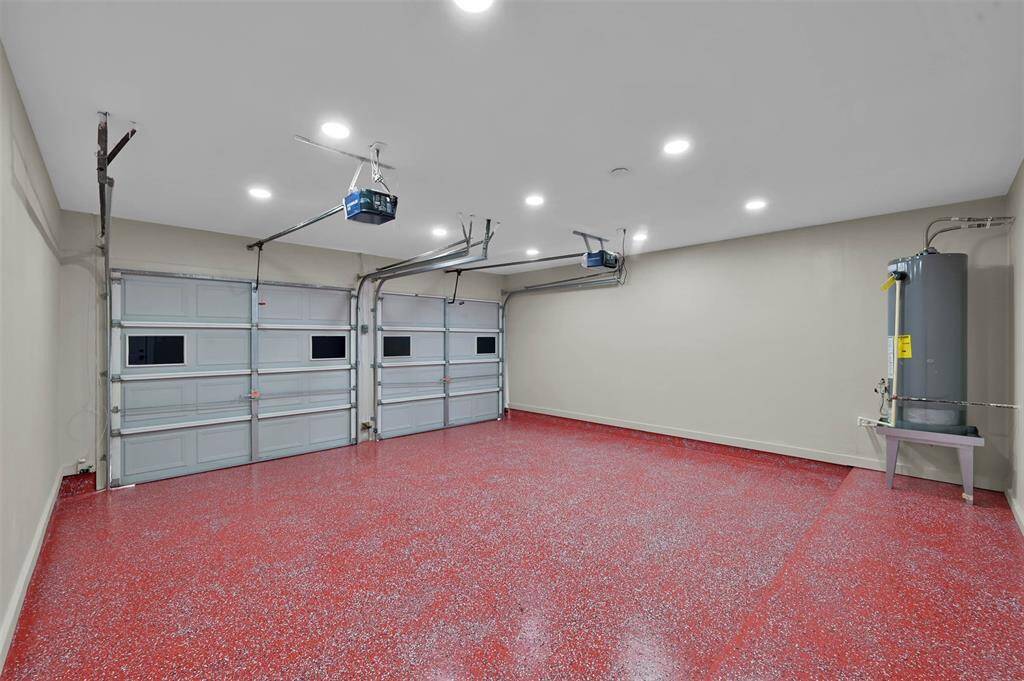 This garage has finished walls and a unique and stylish epoxy flooring.