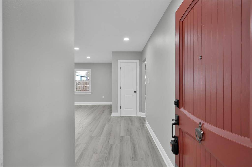 Entering your new home you'll be met with all new flooring, lighting fixtures, and a fresh coat of paint. The entry closet is directly ahead.