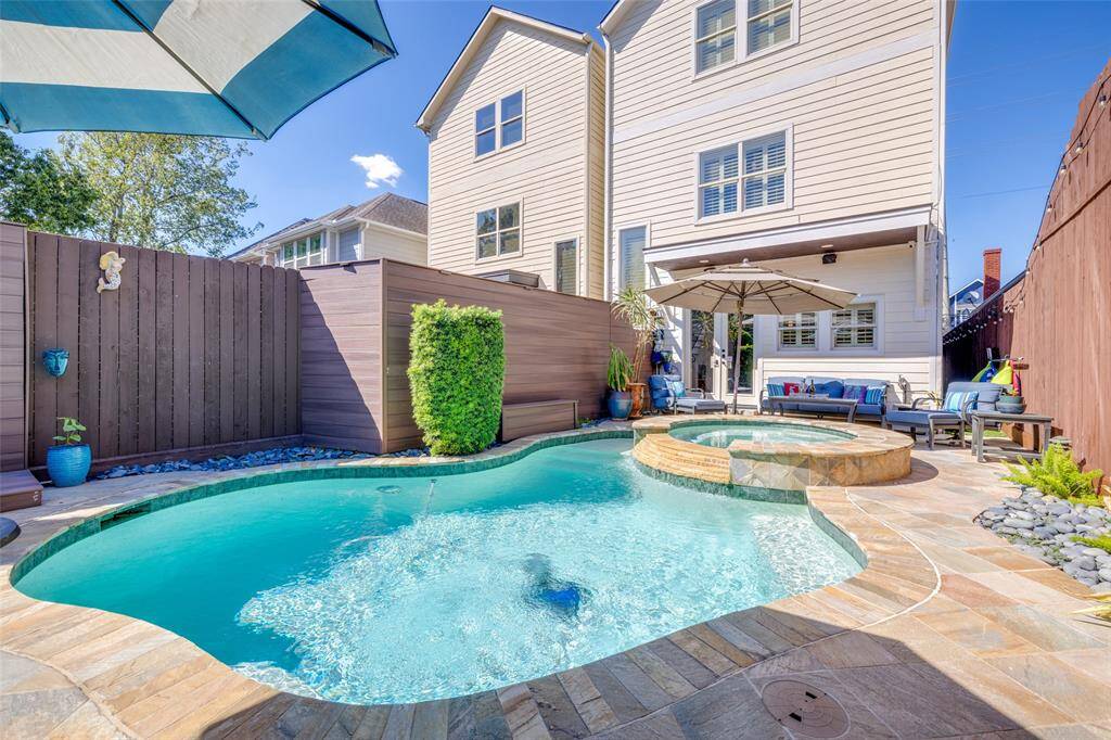 Enjoy Houston's weather all year round in this very private, beautiful professionally landscaped back yard with heated salt water pool & spa, outdoor kitchen with Duro BBQ, refrigerator, sink & outdoor shower. Pentair App controls multi color lights, temperature etc