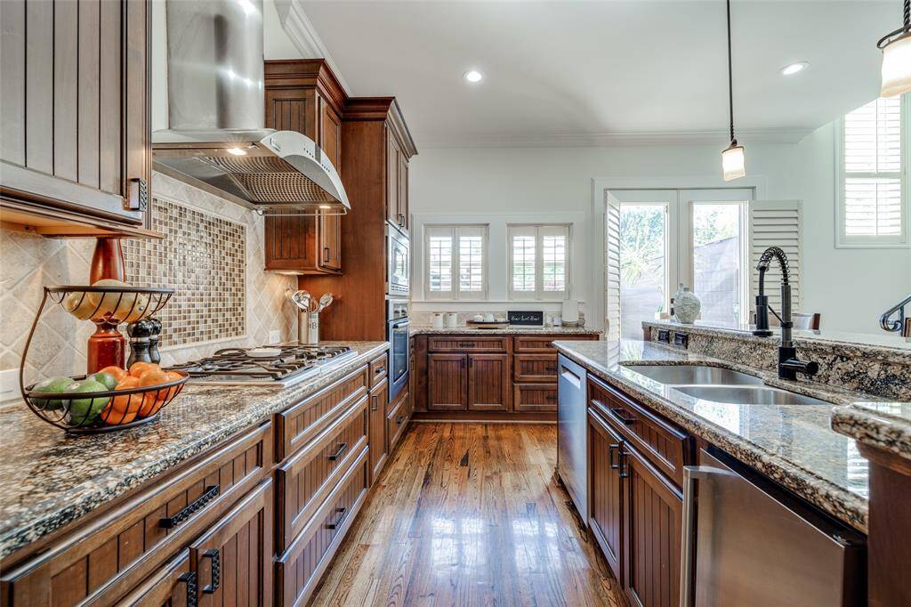 Large Kitchen with lots of counter space, beautiful custom cabinets with under cabinet lighting, high end SS appliances