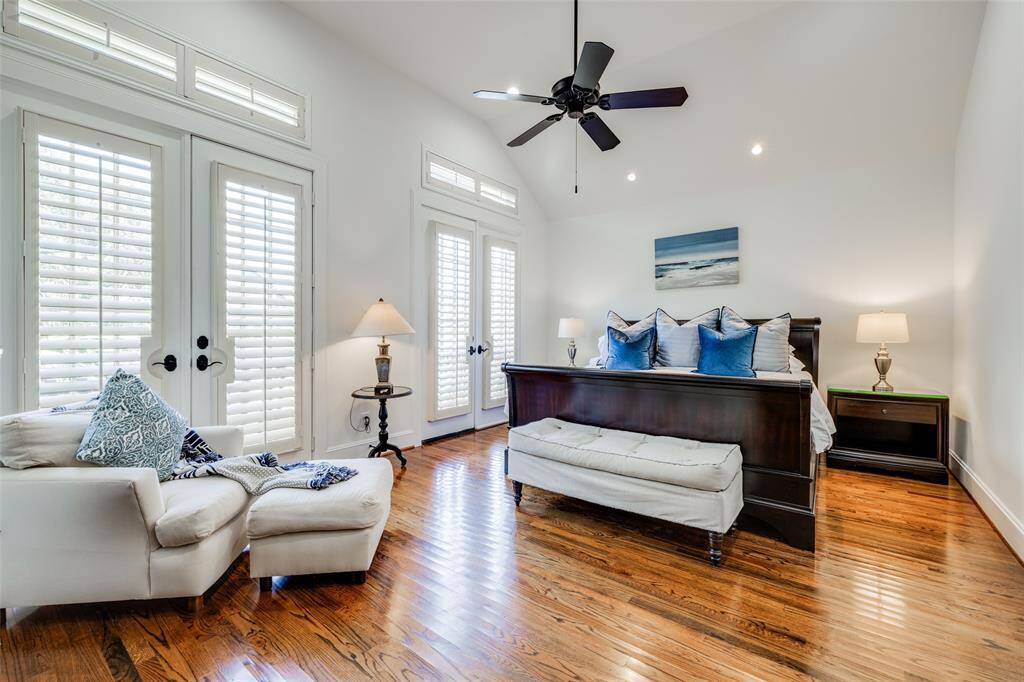 Huge Primary bedroom to front of the house with high ceiling, sitting area, plantation shutters, ceiling fan, new LED lights, reading lights above the bed, recently painted