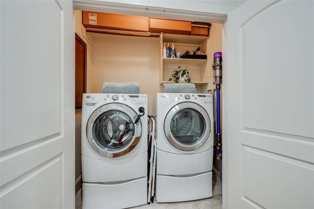 Utility room on second floor just outside the Primary Suite, front loading washer & dryer included in the sale, storage shelves for detergent