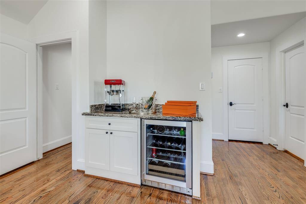 Fabulous 3rd floor huge room can be game room, 4th bedroom or great office if working from home, lots of extra storage and access to full bathroom, sink & beverage refrigerator