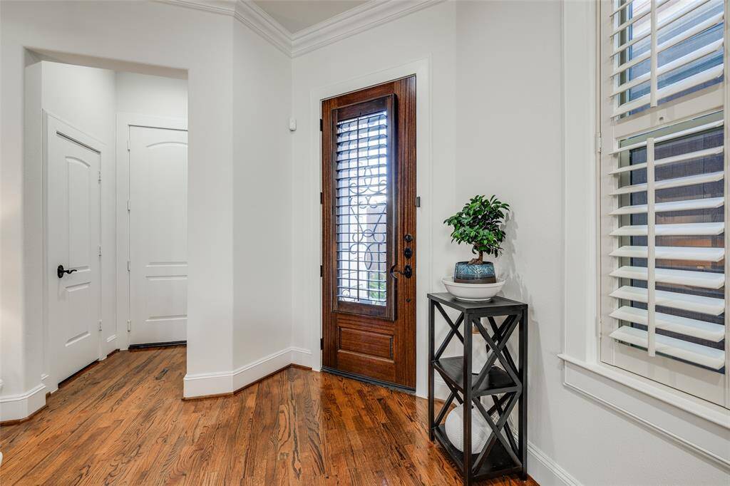 Enter this recently remodeled home through a beautiful lead glass door to this rare to find first floor living, oak hard wood floors throughout the whole home, lots of storage and natural light