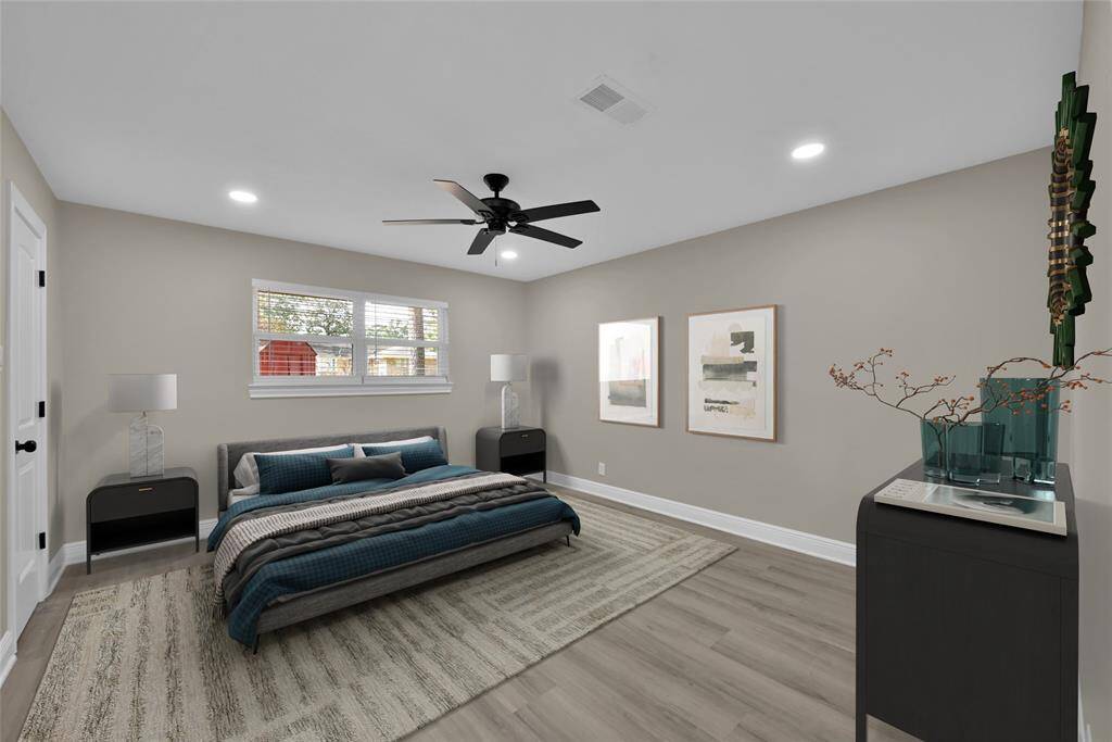The spacious 14' x 13' primary bedroom has views into the large backyard and can accommodate a variety of room layouts.*Virtually Staged