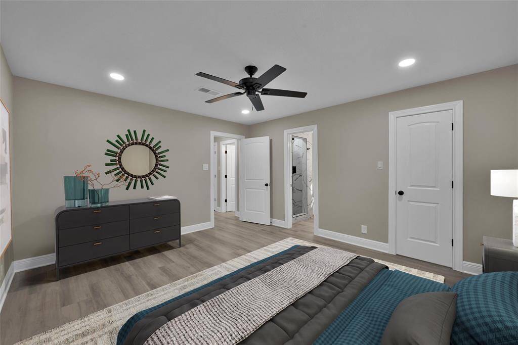 This spacious room has a nice neutral palette and sleek modern touches. The wood-look floors add a warm, cozy feel.*Virtually Staged