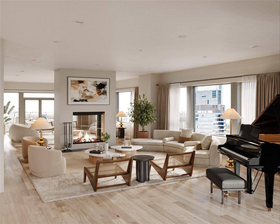 *LIVING ROOM VIRTUAL RENDERING* Experience ultimate sophistication in this expansive living room featuring a stunning dual-sided fireplace, as envisioned in Kirksey Architecture's floorplans for the Belfiore penthouse on the 25th floor. The open layout invites natural light and panoramic views of downtown, Uptown, & Tanglewood, creating a seamless connection between indoor and outdoor living with access to two separate terraces. Customize every detail of this luxurious space to reflect your personal style.