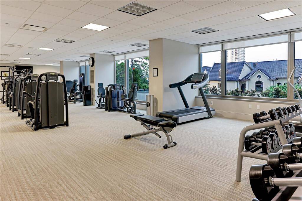 FITNESS CENTER - Stay fit and active in the Belfiore condo’s state-of-the-art fitness center, offering top-tier equipment and stunning views. This fitness center enhances the luxury lifestyle found throughout the Belfiore, truly providing every amenity imaginable at your fingertips.