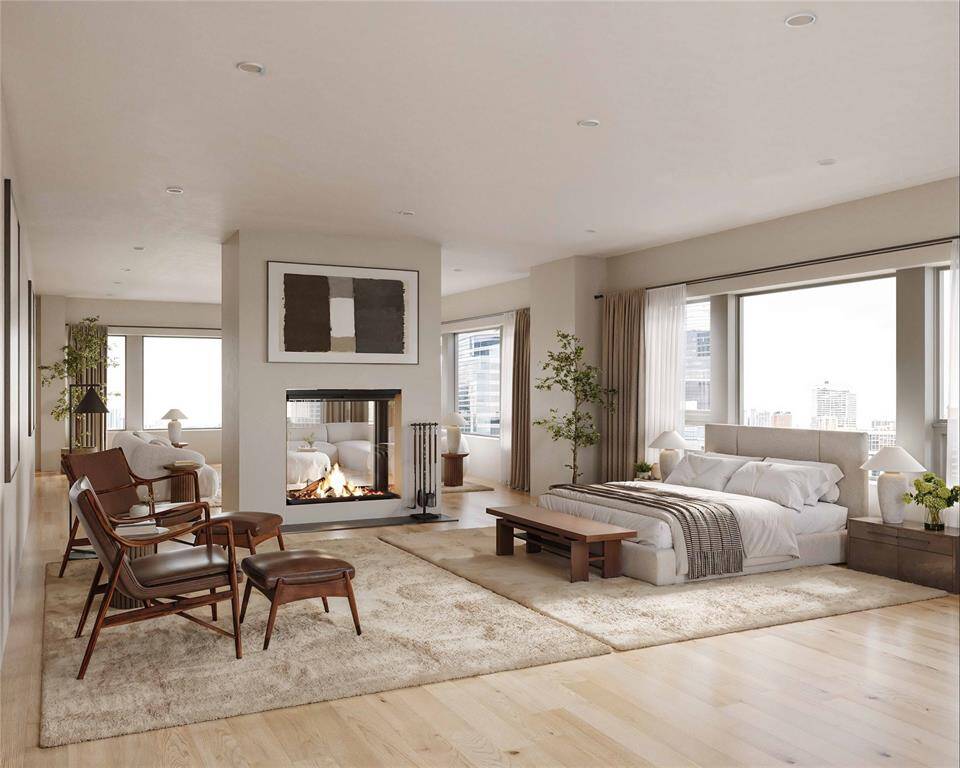 *PRIMARY BEDROOM VIRTUAL RENDERING* Unwind in this luxurious primary suite, where a dual-sided fireplace elegantly separates the bedroom from a private sitting area, creating a serene retreat as envisioned by Kirksey Architecture on the 26th floor. Floor-to-ceiling windows frame breathtaking views of Houston, offering a perfect blend of comfort and sophistication. With endless customization options, this space can be tailored to your unique taste.