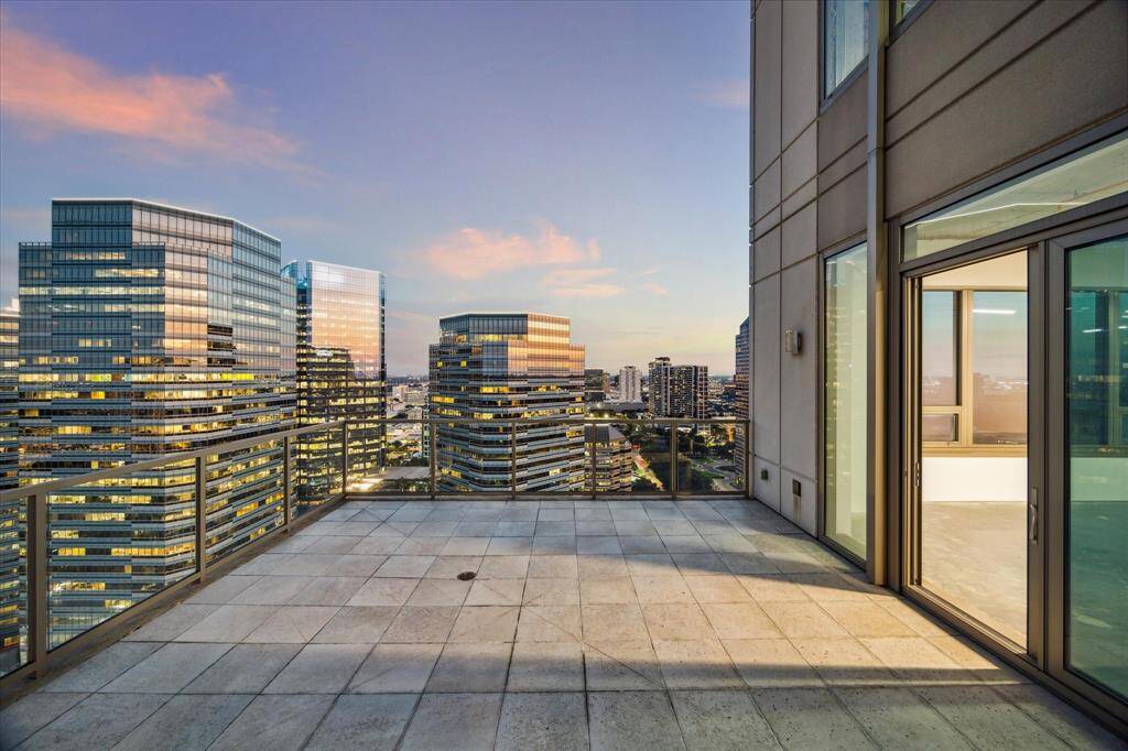 EAST TERRACE - Step onto the East-facing terrace and take in sweeping views of Uptown’s premier shopping and dining destinations, offering a true urban lifestyle. This expansive outdoor space connects seamlessly to the formal living and dining rooms, providing the perfect vantage point for enjoying the vibrant cityscape below.