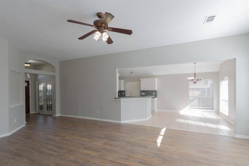 Your view from living room looking into the kitchen breakfast area