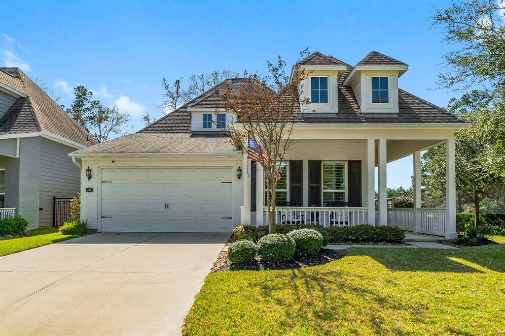 Classically designed welcoming front wrap around porch, a two-car garage, and a well-maintained yard.