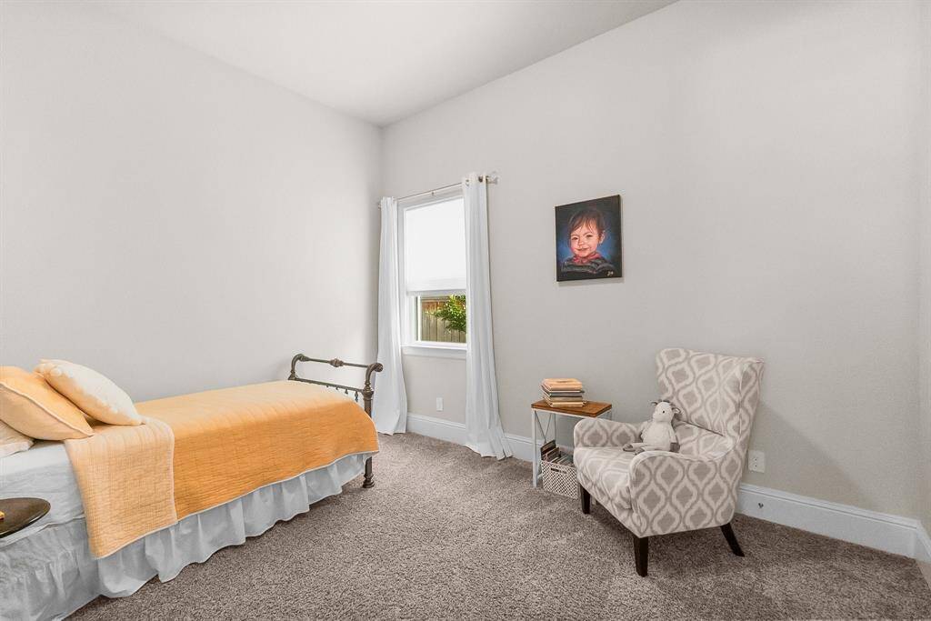Third bedroom with neutral design and decor.