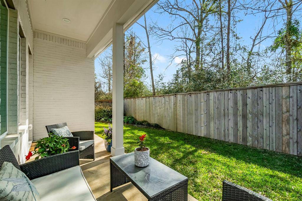 Enjoy a private oasis with a spacious covered patio and secure fenced yard.