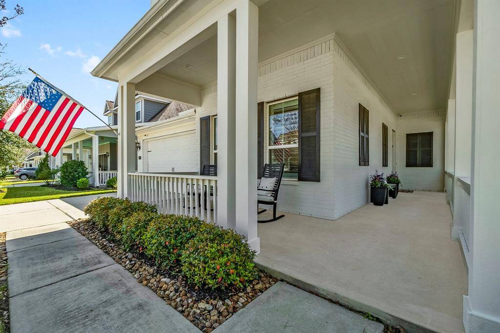 Charming home with a spacious front porch and landscaped grounds.
