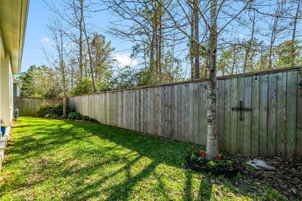 Enchanting fenced backyard, ideal for creating your garden retreat.