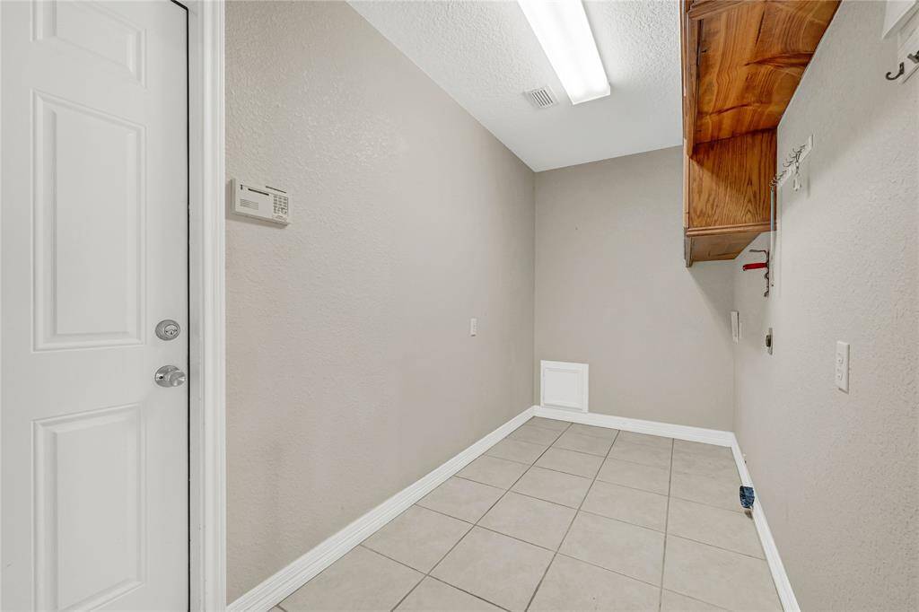 Large utility/mud room located off of the garage.