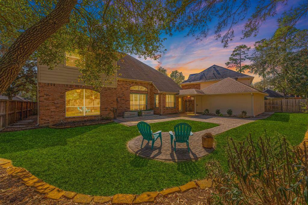 Peace and tranquility in this beautifully landscaped back yard with custom pavers, and added stepping stones on sides of the home to the front gates.