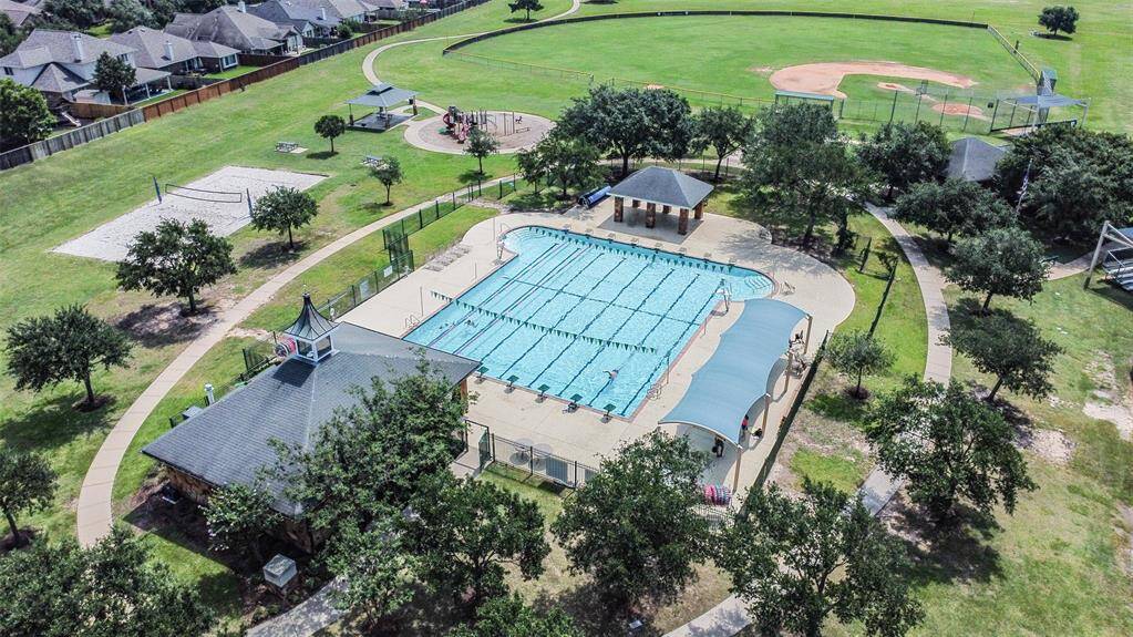 Competition swimming pool, sand volleyball court, playground and baseball fields