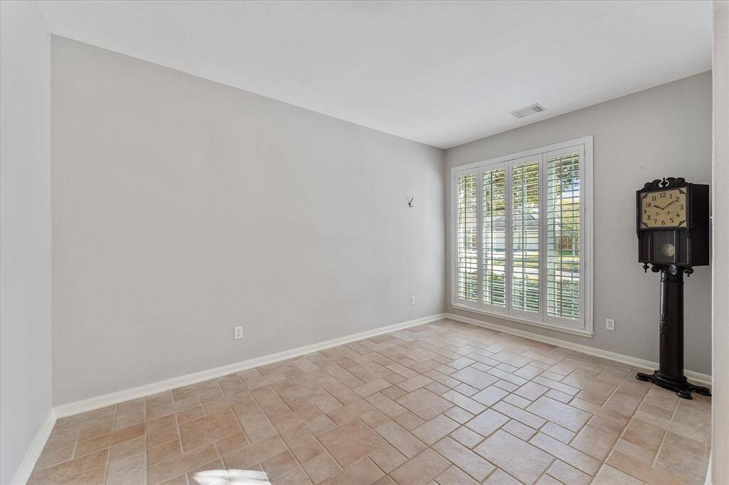 Versatile flex room for possible sunroom, playroom, home office or formal living area.